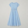 A light blue and white vertically striped short-sleeve dress with a smocked waist, shown flat against a light gray background.