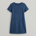 A short-sleeve blue linen dress with a round neckline and two front patch pockets, shown flat against a light gray background.